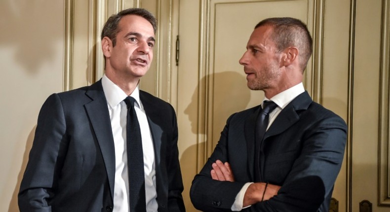 Greek Prime Minister Kyriakos Mitsotakis (L) with UEFA president Aleskander Ceferin