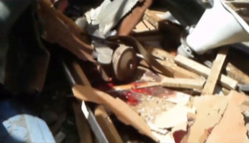 Still image taken from a video shows a blood stain at blast attack site in Mubi
