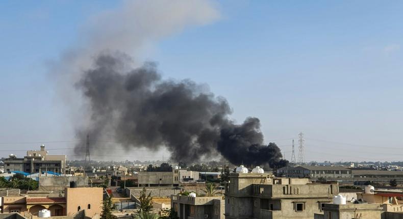 Plumes of smoke rise from the Tripoli suburb of Tajoura after it was hit by an air strike launched by forces loyal to Libya strongman Khalifa Haftar