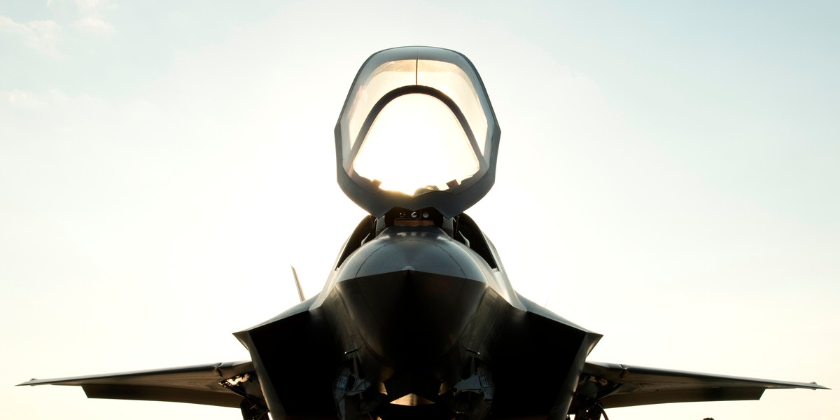 The flight deck crew secures an F-35B Lighting II aircraft aboard the amphibious assault ship USS Wasp.