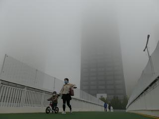 UNCLEAR Heavy fog in Tianjin, China. The country officially plans to become “carbon neutral” by 2060, but climate experts aren’t satisfied