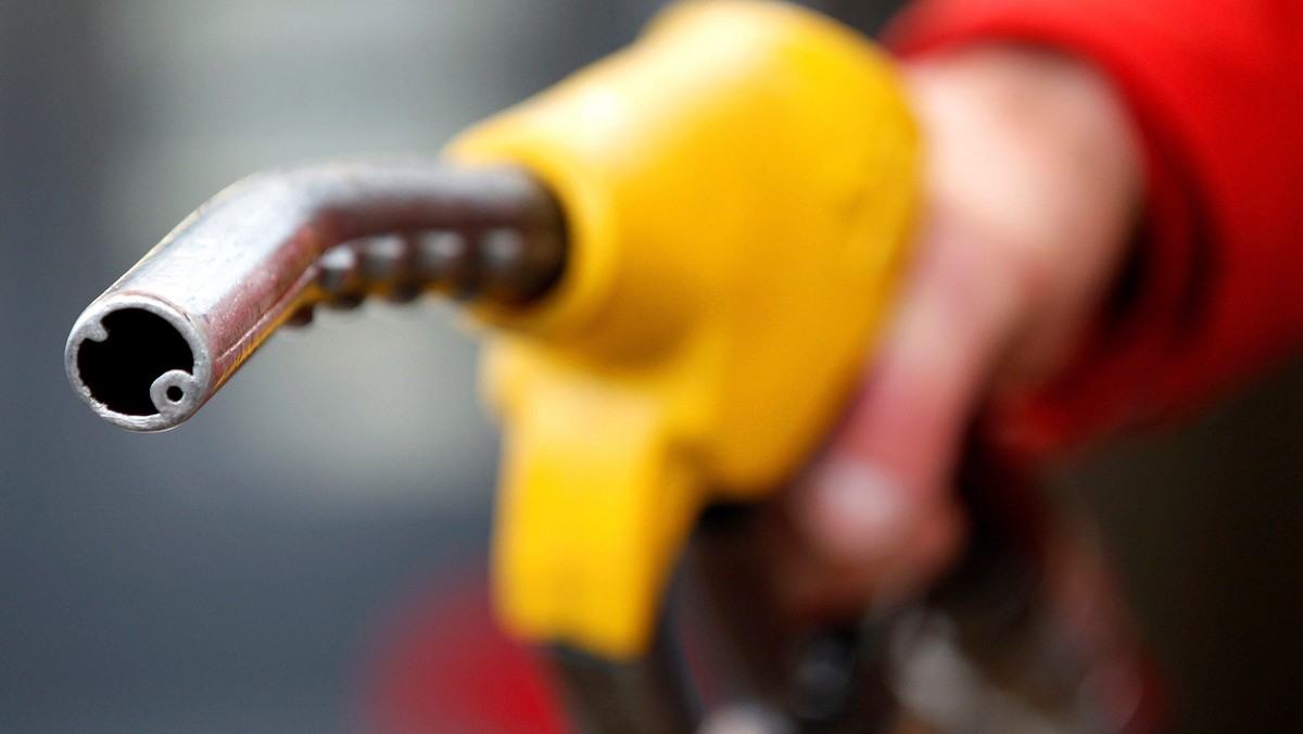 FILE PHOTO: An attendant prepares to refuel a car at a petrol station in Rome