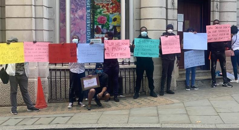 NDDC scholarship beneficiaries protested at the Nigerian High Commission in London on Monday, August 3, 2020 [Twitter/@OmoKakafiala]