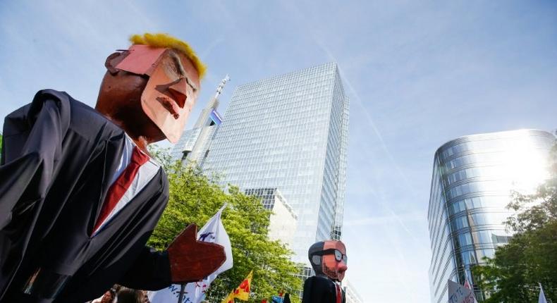 Protesters carried effigies of US President Donald Trump as well as Belgian Prime Minister Charles Michel during a demonstration in Brussels on Wednesday