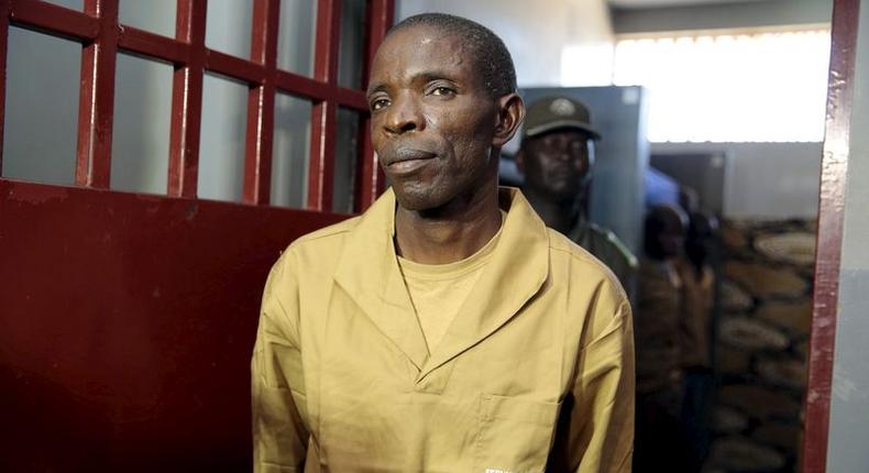 Sect leader Jose Kalupeteka is escorted by police in Huambo, Angola, in this picture taken May 5, 2015. The details of a police raid on April 16 in the remote hills of central Huambo province have been fiercely contested, sharpening the divide between the ruling MPLA and the main opposition party UNITA, who fought on opposing sides in a 27-year civil war that ended in 2002. The Angolan police said 13 snipers from The Light of the World were killed during a raid targeted at capturing Kalupeteka, a popular anti-authority preacher who says the world will end on Dec. 31.  REUTERS/Herculano Coroado