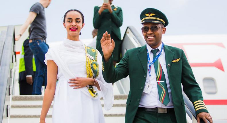 Ethiopian Airlines pilot (right) and an air hostess disembark from the inaugural flight into Victoria-Falls.