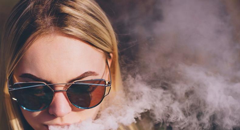 woman vaping vape e-cig