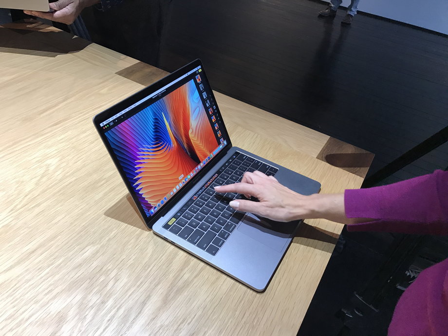 Apple's new-model MacBook Pros sport a touch-sensitive strip.