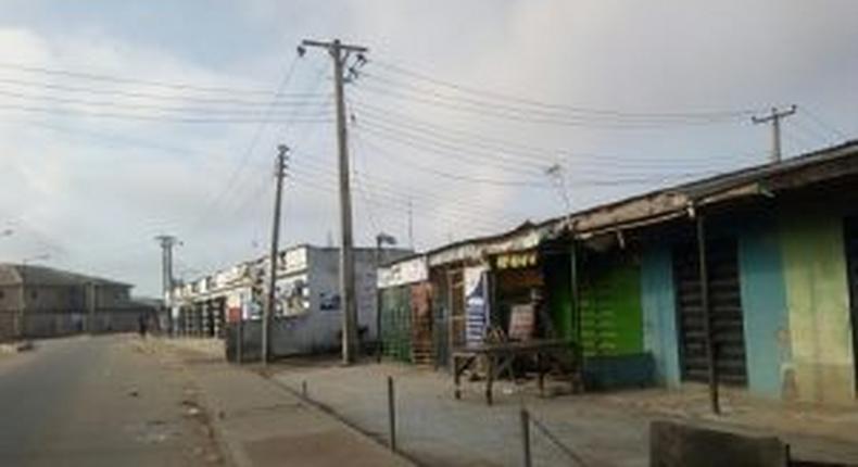 Some shops closed in compliance with the curfew directive in Iyana Ipaja area of Lagos State on Wednesday. [NAN]