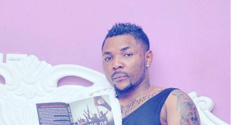 Singer Oritsefemi reading 'Rise of ISIS'