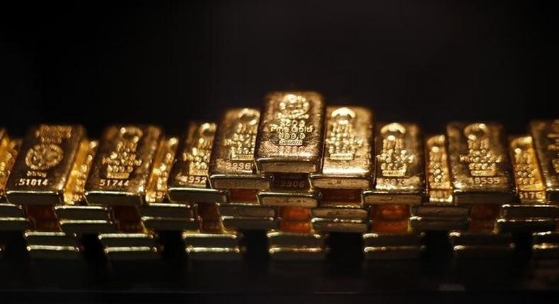 Gold bars are stacked at a safe deposit room of the ProAurum gold house in Munich March 6, 2014. REUTERS/Michael Dalder