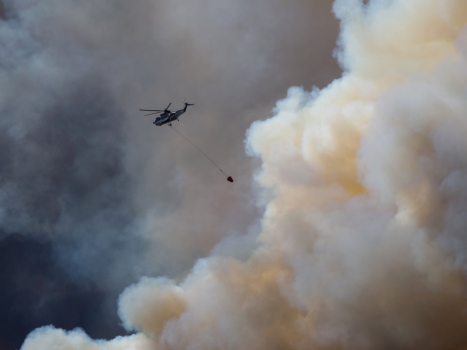 Helicopters are being used to battle the raging fire.