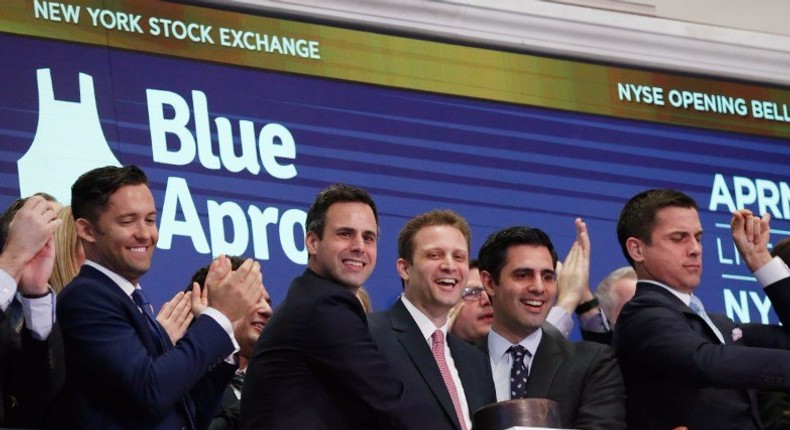 Blue Apron CEO Matthew B. Salzberg celebrates with co-founders Ilia Papas and Matt Wadiak during the company's IPO on the New York Stock Exchange in New York