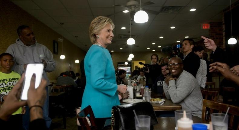Democratic presidential nominee Hillary Clinton visits with customers at the Cedar Park Cafe on November 6, 2016 in Philadelphia, Pennsylvania