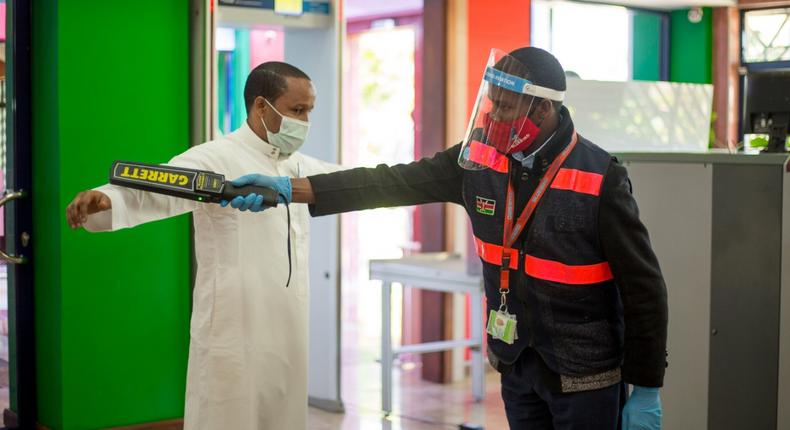 A traveler goes through checks at a local airport