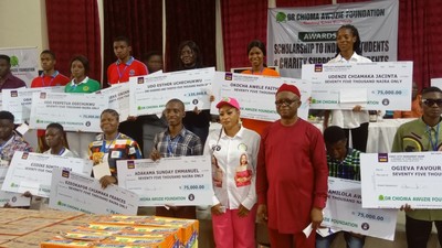 Group photograph with beneficiaries of the scholarship scheme of Dr Chioma Awuzie Foundation (DCAF) in Anambra. [NAN]