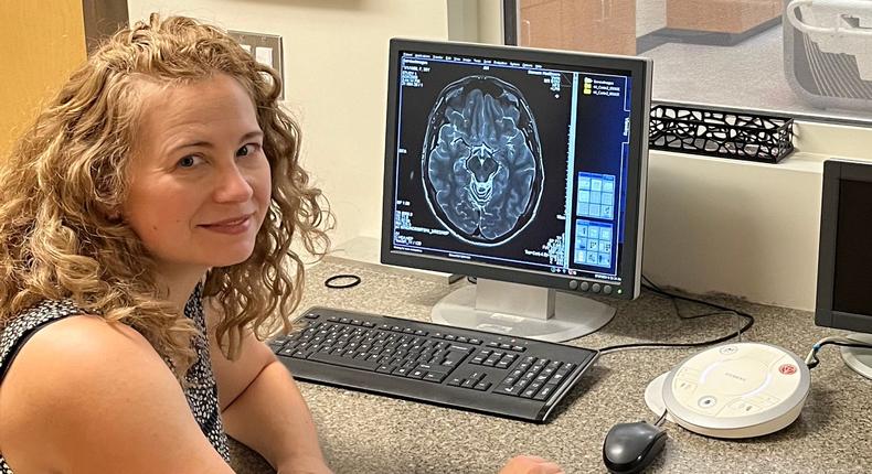 Liz Chrastil looking at an MRI of her brain.Liz Chrastil