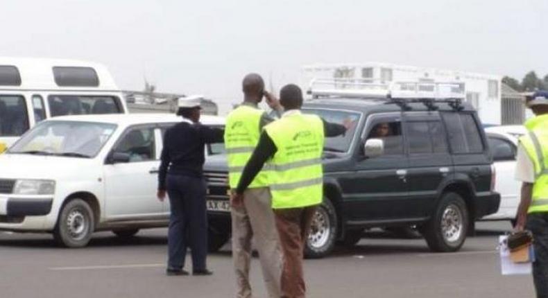 Officers from the National Transport and Safety Authority (NTSA) and National Police Service during an operation to nab drunk drivers