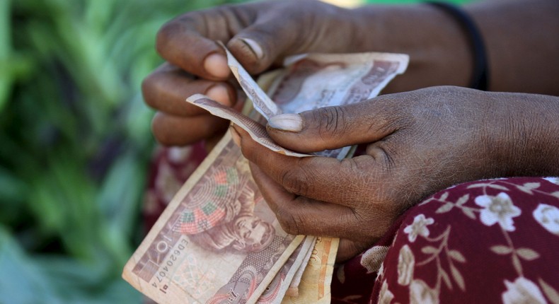 A woman counts Ethiopian birr notes ( REUTERS/Tiksa Negeri)