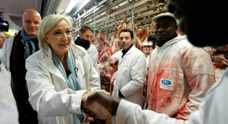 The atmosphere was cordial for the most part during Le Pen's visit to Europe's biggest wholesale fresh food market, but she also drew boos