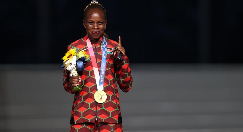 TOKYO, JAPAN - AUGUST 08: Gold medalist Peres Jepchirchir of Team Kenya poses during the medal ceremony for the Women's Marathon Final during the Closing Ceremony of the Tokyo 2020 Olympic Games at Olympic Stadium on August 08, 2021 in Tokyo, Japan. (Photo by Naomi Baker/Getty Images)