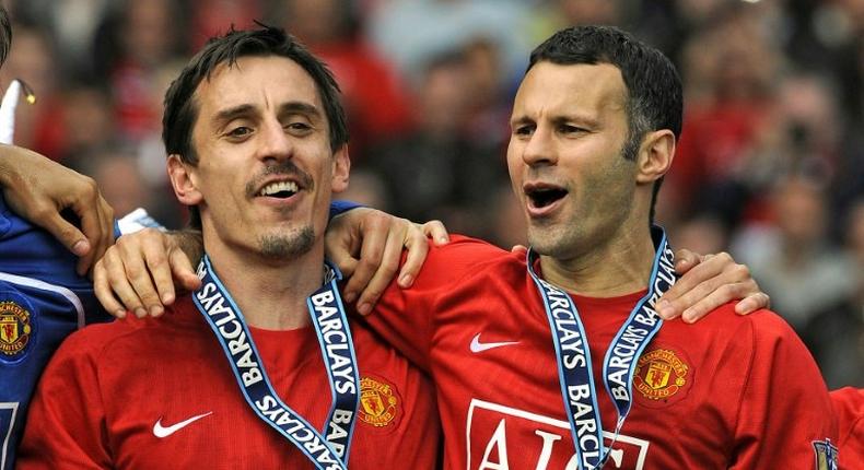 Gary Neville (L) and Ryan Giggs celebrate winning the Premiership with Manchester United in 2009