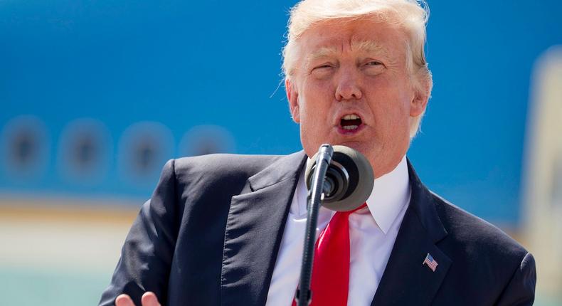 President Donald Trump speaks about healthcare in front of Air Force One, Tuesday, June 13, 2017, at General Mitchell International Airport in Milwaukee, Wis.