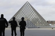 French police secure the site near the Louvre Pyramid in Paris