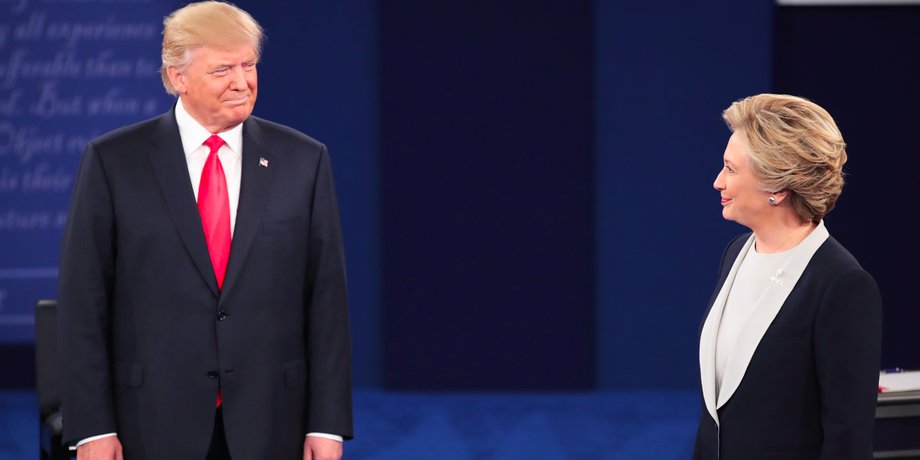 Republican presidential nominee Donald Trump (L) and Democratic presidential nominee former Secretary of State Hillary Clinton during the town hall debate at Washington University on October 9, 2016 in St Louis, Missouri.