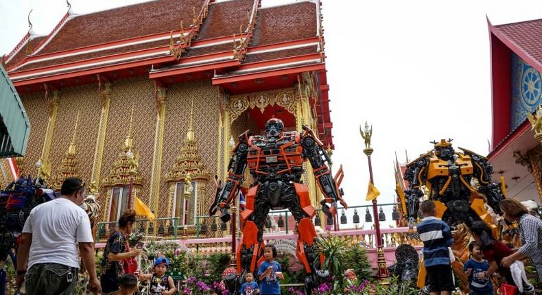 Instead of the traditional tranquil Buddhas and mythical beasts that adorn most monasteries in the land, the shimmering Wat Ta Kien temple outside Bangkok is guarded by three towering Transformer robots