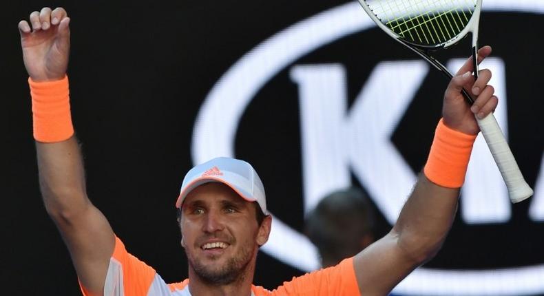 Germany's world number 50 Mischa Zverev celebrates his victory against Britain's Andy Murray during their fourth round match at the Australian Open in Melbourne on January 22, 2017