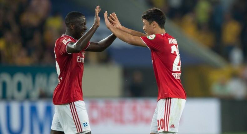 Hamburg forward Hwang Hee-chan (R) celebrates after his goal sealed a 1-0 win at Dresden