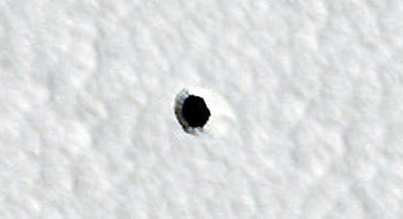 This 2022 image taken by the HiRISE camera onboard NASA's Mars Reconnaissance Orbiter has reignited the conversation around these mysterious holes on Mars.NASA/JPL-Caltech/UArizona