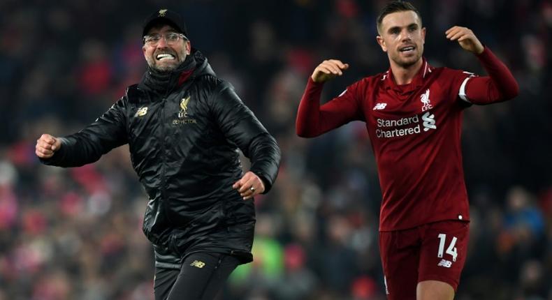 Liverpool manager Jurgen Klopp (left) and captain Jordan Henderson (right) celebrate a thrilling 4-3 win over Crystal Palace