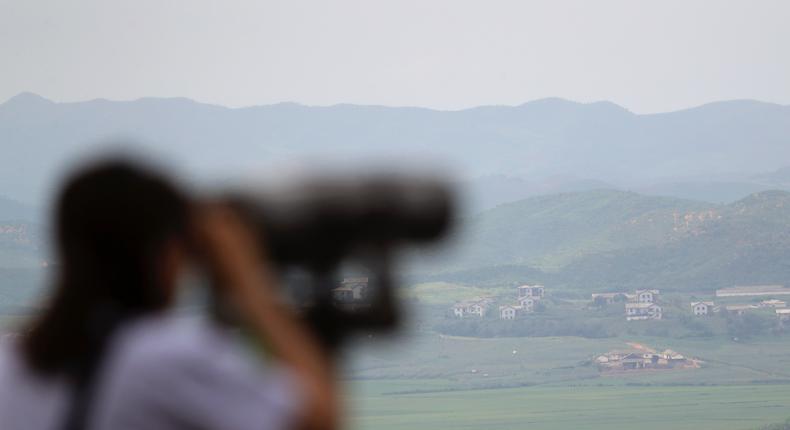 A visitor uses binoculars to see the North Korea side from the unification observatory in Paju, South Korea, Thursday, Aug. 17, 2017.