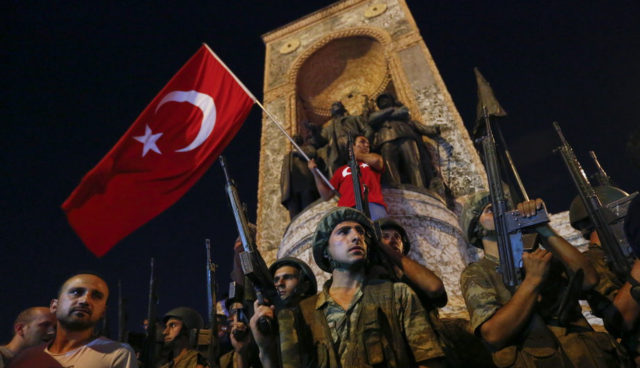 People demonstrate in front of the Republic Monument at the Taksim Square in Istanbul, Turkey, July 16, 2016.