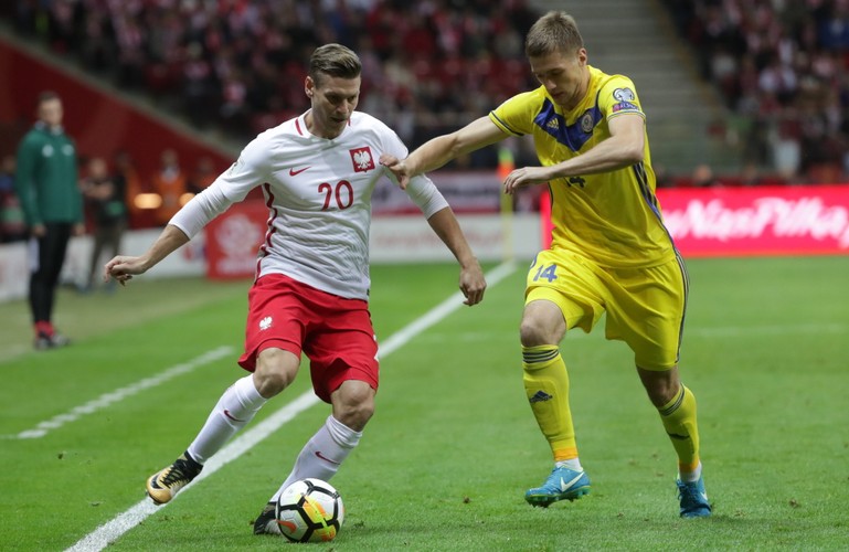 Łukasz Piszczek (L) i Roman Murtazajew (P)