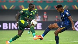 Senegal forward Sadio Mane (L) is challenged by Cape Verde defender Steven Fortes during an Africa Cup of Nations last-16 match in Bafoussam on Tuesday Creator: Pius Utomi EKPEI