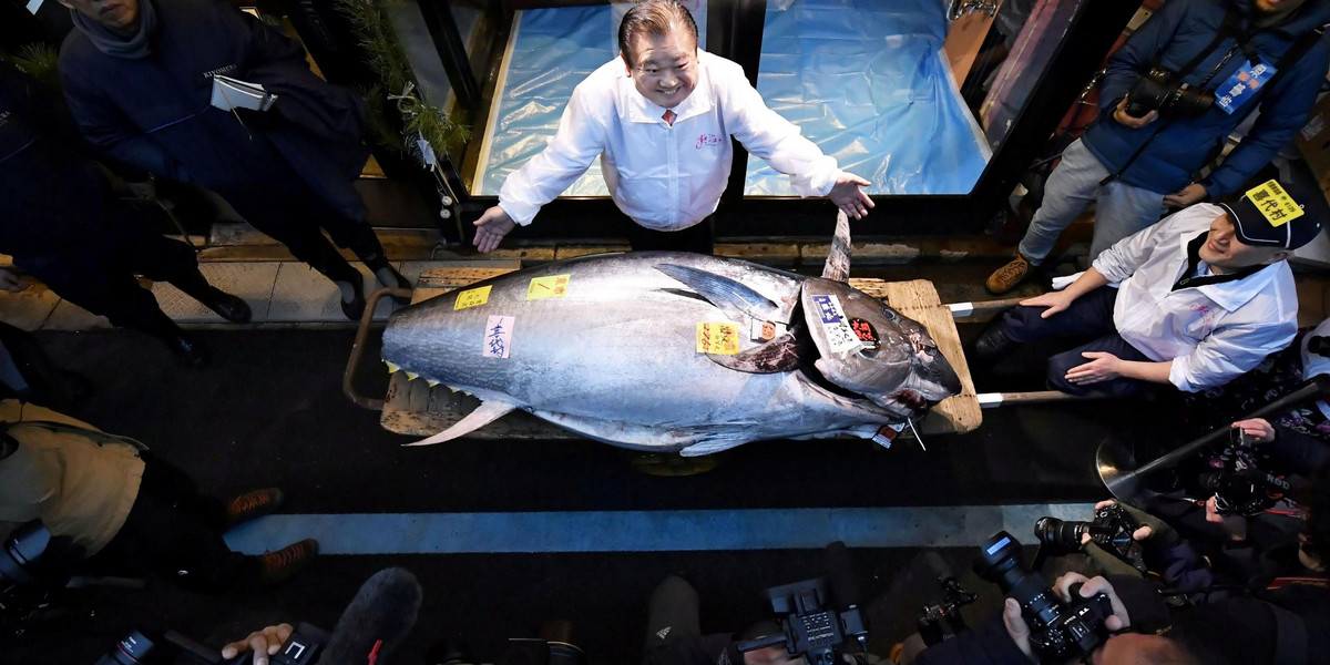 Kiyoshi Kimura, president of Kiyomura Corp., poses with a bluefin tuna in Tokyo