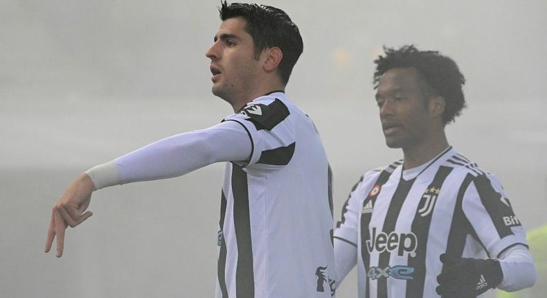 Alvaro Morata (L) and Juan Cuadrado ensured Juventus won at Bologna Creator: Vincenzo PINTO