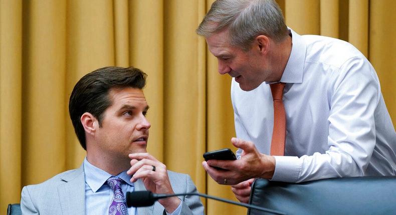 GOP Reps. Matt Gaetz of Florida, left, and Rep. Jim Jordan of Ohio confer as the House Judiciary Committee holds an emergency meeting to advance a series of Democratic gun control measures on June 2, 2022.