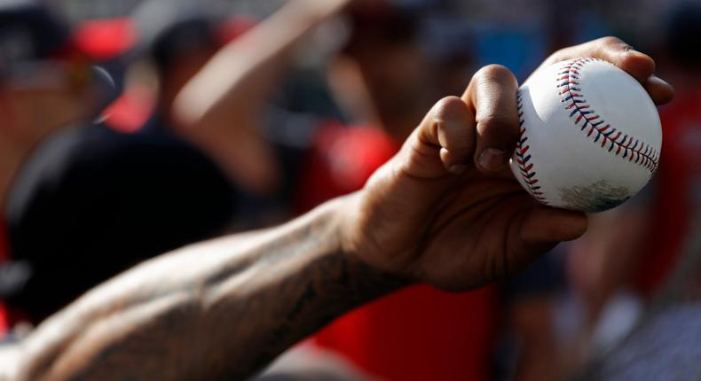 Marcus Stroman, of the Toronto Blue Jays, holds a baseball as the American League players take batting practice before the MLB baseball All-Star Game, Tuesday, July 9, 2019, in Cleveland. (AP Photo/John Minchillo)