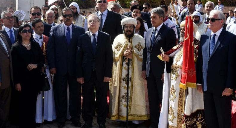 Russian ambassador to Egypt Sergei Kerbachenko (3L) attends a mass on October 31, 2016 at the al-Sammaeen cathedral in Sharm el-Sheikh marking a year since jihadists bombed a Russian Metrojet airliner carrying holidaymakers