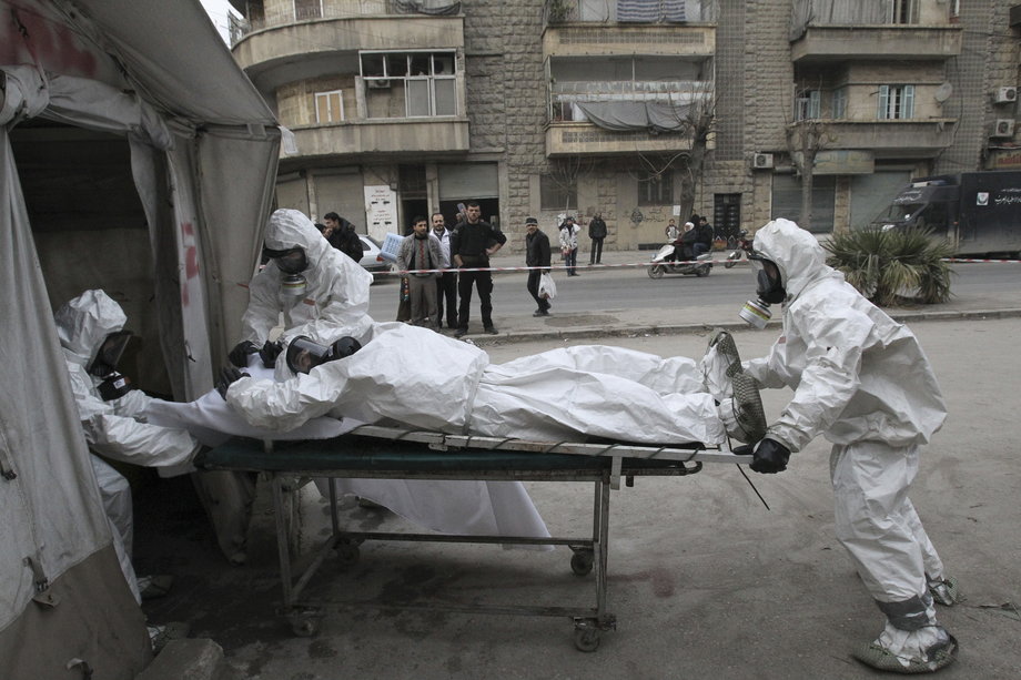 A Free Syrian Army medical group trains people on how to cope with chemical weapon attacks in Aleppo, December 25, 2013.