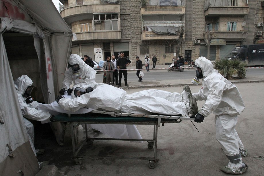 A Free Syrian Army medical group trains people on how to cope with chemical weapon attacks in Aleppo, December 25, 2013.