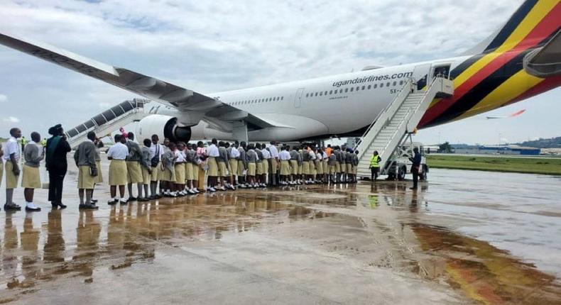 Uganda Martyrs students boarding a flight to Dubai