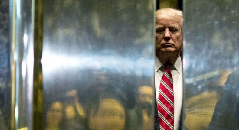 Donald Trump boards the elevator at Trump Tower in New York City.Dominick Reuter/AFP via Getty Images