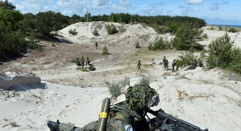 A soldier takes part in NATO military exercises off the coast of Ustka, northern Poland