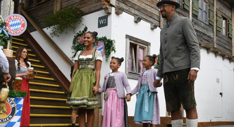Bayern Munich defender Jerome Boateng with his family on a visit to the Munich beer festival