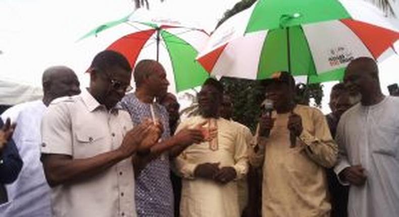 Representatives of defectors from the All Progressives Congress (APC) receiving umbrella of the People’s Democratic Party (PDP) in Benin on Friday.